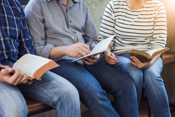 People reading the Bible together in a small group
